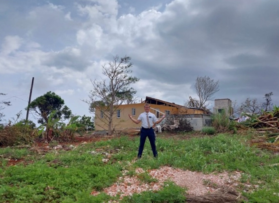 A person standing in a field with his arms raised

AI-generated content may be incorrect.