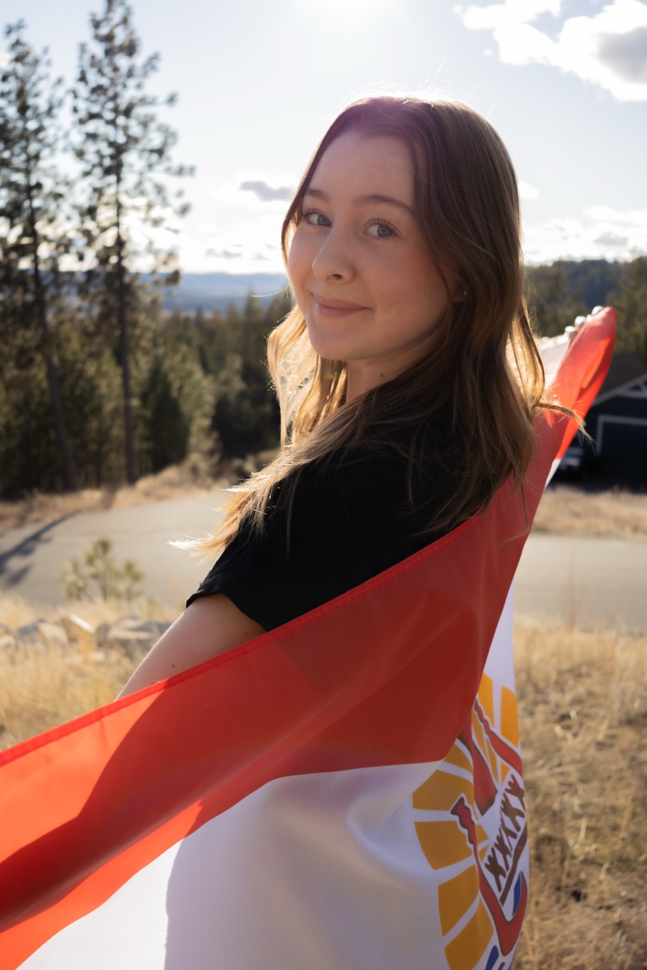 A person holding a flag

AI-generated content may be incorrect.