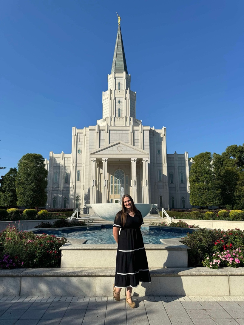 A person standing in front of a white building

AI-generated content may be incorrect.