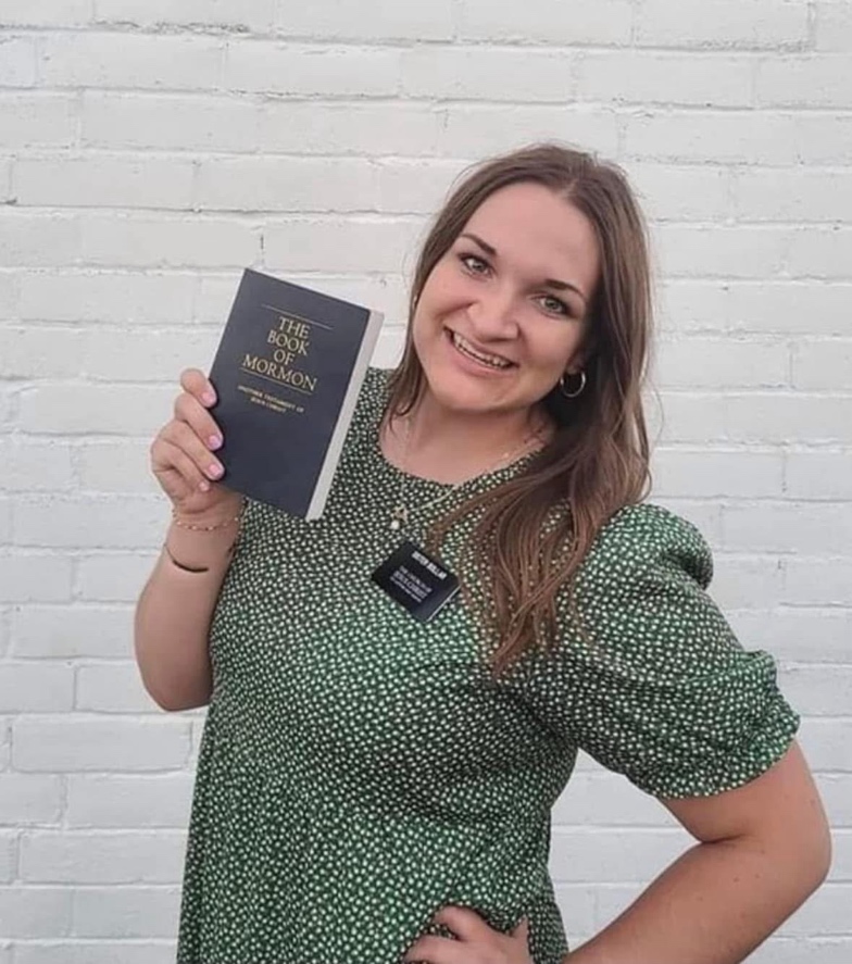 A person holding a book

AI-generated content may be incorrect.