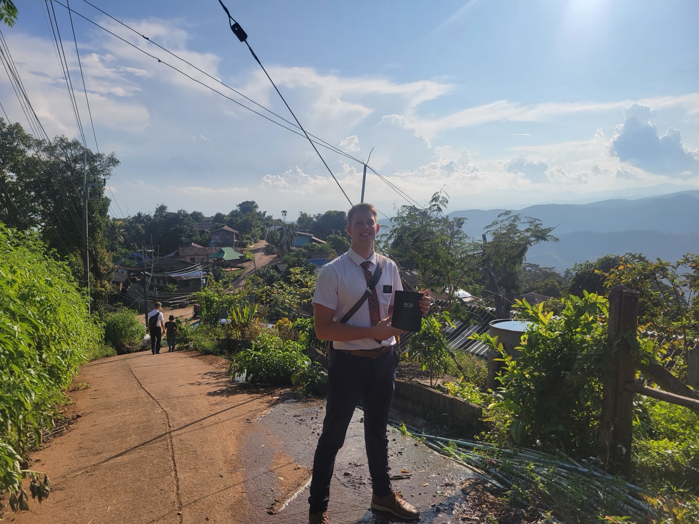 A person standing on a path with a clipboard

AI-generated content may be incorrect.