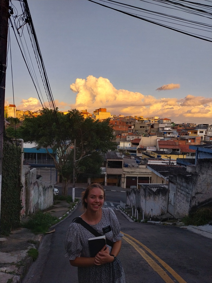 A person standing on a street with buildings in the background

AI-generated content may be incorrect.