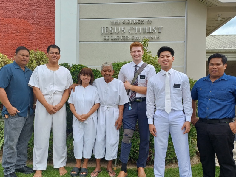 A group of people standing in front of a building

AI-generated content may be incorrect.