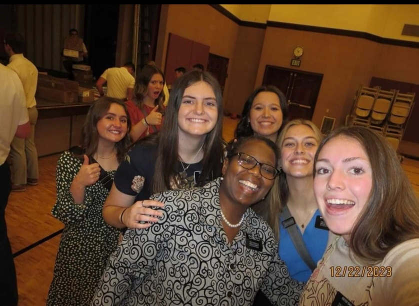 A group of women posing for a photo

AI-generated content may be incorrect.