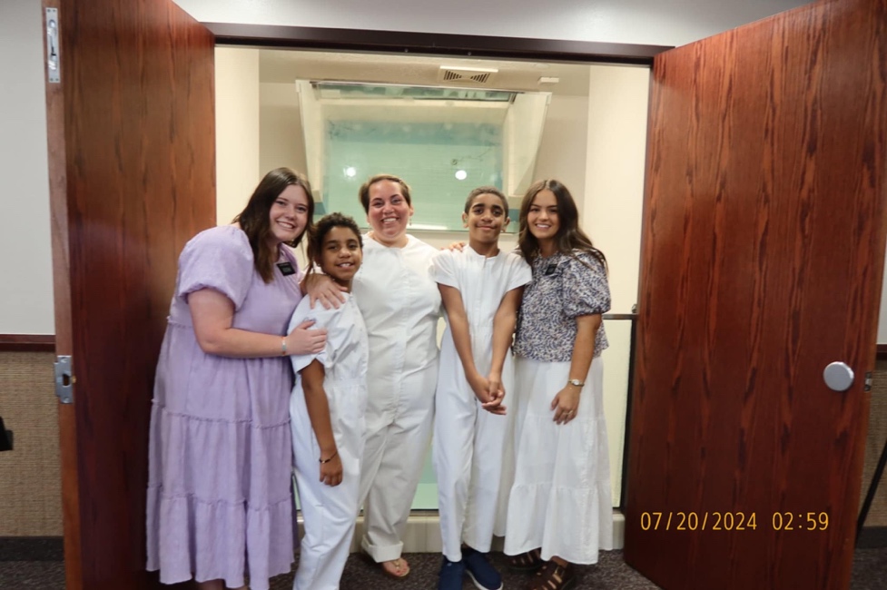 A group of people standing in a doorway

AI-generated content may be incorrect.