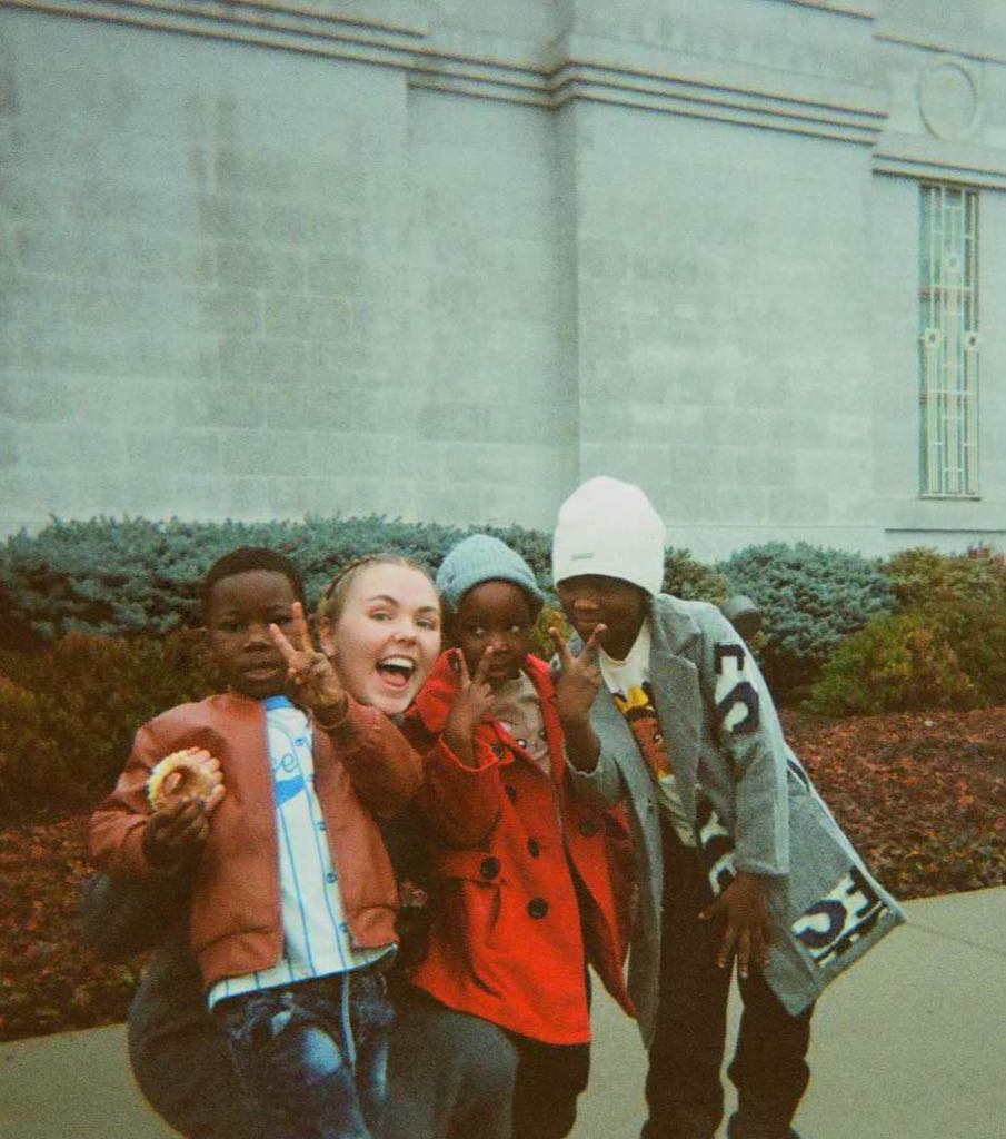 A group of people posing for a picture

AI-generated content may be incorrect.