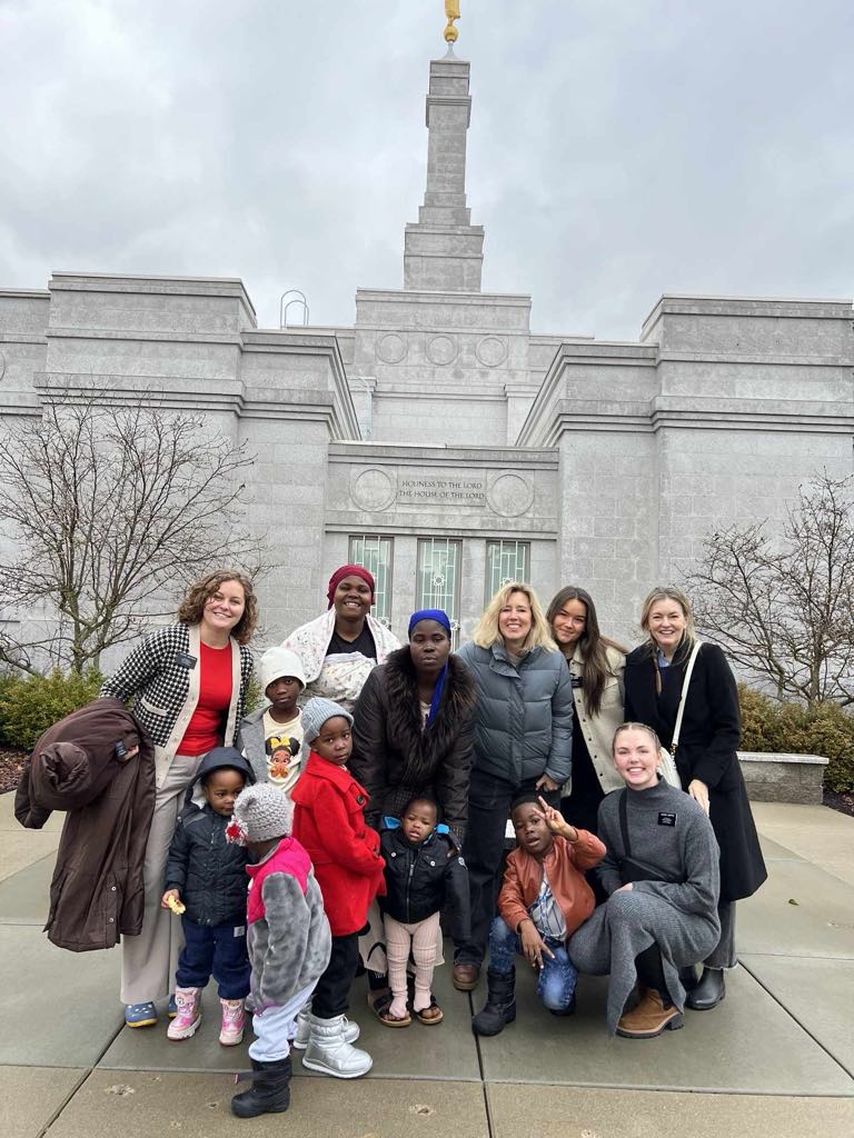 A group of people posing for a photo in front of a temple

AI-generated content may be incorrect.